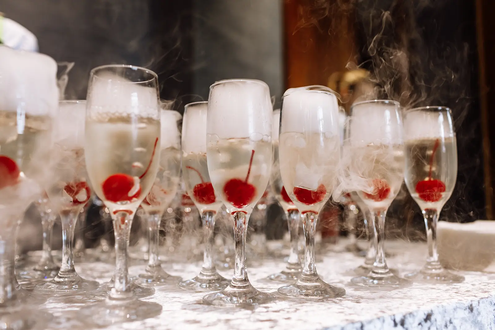 glasses with champagne with cherry and steam from 2023 01 06 10 37 18 utc