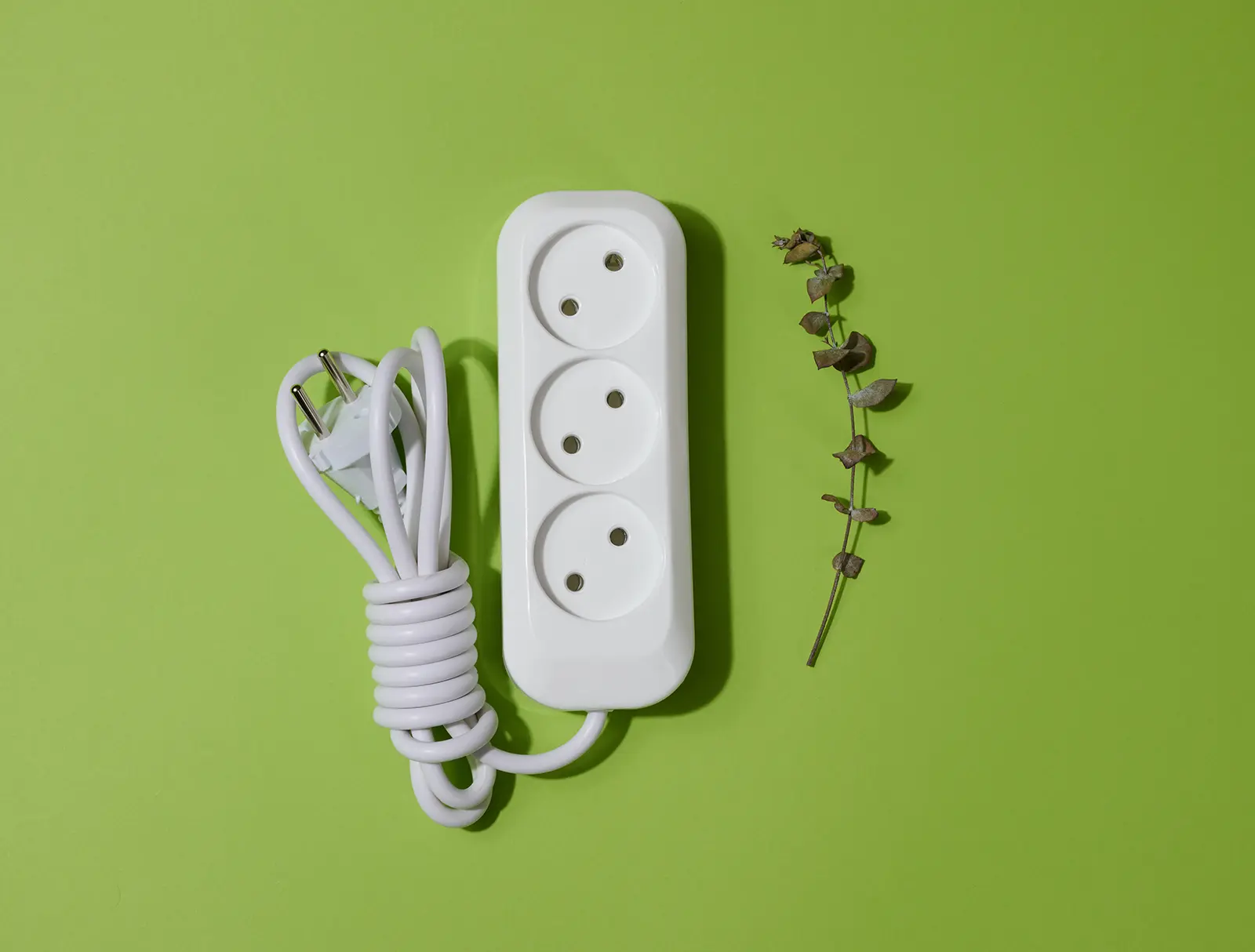 white plastic socket with cable on a green backgro 2023 01 03 18 10 53 utc